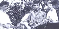 Lennon as a teenager with guitar